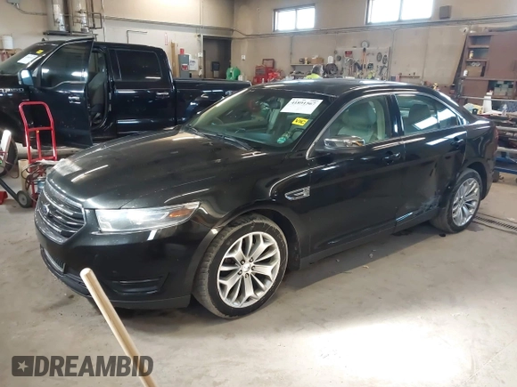 2015 Ford Taurus Limited with VIN 1FAHP2J87FG172580, listed as a IAAI auction lot 41891567 with 183,784 mi miles. Bid and sale history available at carsss.com. Image 2.