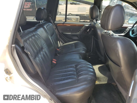 1999 Jeep Grand Cherokee Limited with VIN 1J4GW68N5XC549051, listed as a Copart auction lot 64376325 with 205,276 mi miles and Clean title. Bid and sale history available at DreamBid. Image 11.