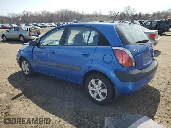 2009 Kia Rio LX with VIN KNADE243296500963, listed as a Copart auction lot 51061595 with 76,596 mi miles and Salvage Title. Bid and sale history available at carsss.com. Image 2.