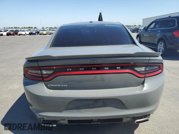 2019 Dodge Charger SXT with VIN 2C3CDXBGXKH659890, listed as a Copart auction lot 58011735 with 112,293 mi miles and Salvage title. Bid and sale history available at DreamBid. Image 6.