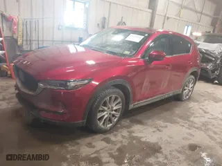 2021 Mazda CX-5 Grand Touring with VIN JM3KFBDMXM1430321, listed as a IAAI auction lot 41622134 with 44,955 mi miles. Bid and sale history available at carsss.com. Image 2.