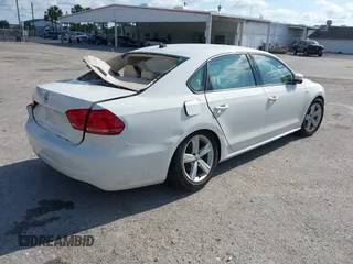 2015 Volkswagen Passat 1.8T Limited Edition with VIN 1VWAT7A3XFC100852, listed as a IAAI auction lot 41204902 with 85,725 mi miles. Bid and sale history available at carsss.com. Image 4.
