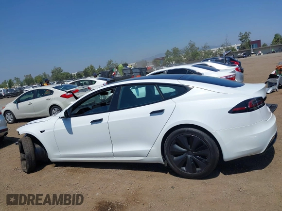 2023 Tesla Model S with VIN 5YJSA1E51PF499919, listed as a IAAI auction lot 42459166 with 6,612 mi miles and . Bid and sale history available at DreamBid. Image 15.