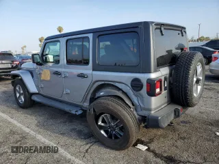 2019 Jeep Wrangler Unlimited Sahara with VIN 1C4HJXEN0KW616942, listed as a Copart auction lot 63501755 with 57,095 mi miles and Salvage title. Bid and sale history available at DreamBid. Image 2.