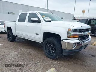 2018 Chevrolet Silverado 1500 LT with VIN 3GCPCREC7JG402401, listed as a IAAI auction lot 41880462 with 128,995 mi miles and . Bid and sale history available at DreamBid. Image 1.