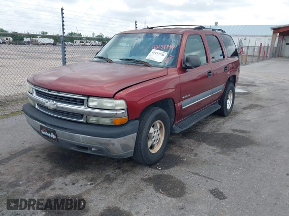 2002 Chevrolet Tahoe LT z VIN 1GNEC13Z62R163285, wystawiony jako IAAI lot #42137746 z przebiegiem 185 129 mil mil oraz . Historia ofert i sprzedaży dostępna na DreamBid. Obrazek 2.