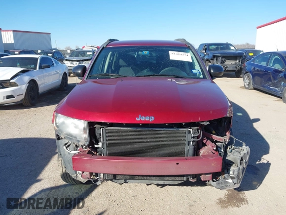 2014 Jeep Compass Sport with VIN 1C4NJCBA3ED812435, listed as a IAAI auction lot 41424374 with 174,663 mi miles and . Bid and sale history available at DreamBid. Image 13.