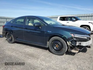 2018 Honda Clarity Touring z VIN JHMZC5F35JC800286, wystawiony jako Copart lot #55320545 z przebiegiem 122 548 mil mil oraz Czysty tytuł • Clean title. Historia ofert i sprzedaży dostępna na DreamBid. Obrazek 4.