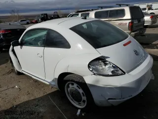 2012 Volkswagen Beetle 2.5L PZEV with VIN 3VWJP7AT1CM630089, listed as a Copart auction lot 82707554 with 79,617 mi miles and Salvage Title. Bid and sale history available at carsss.com. Image 2.