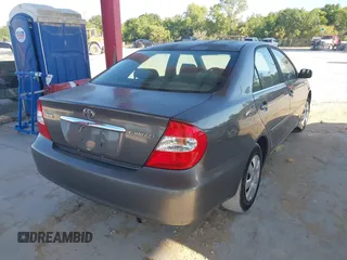 2004 Toyota Camry LE with VIN 4T1BE32KX4U916477, listed as a IAAI auction lot 42018299 with 149,247 mi miles. Bid and sale history available at carsss.com. Image 4.