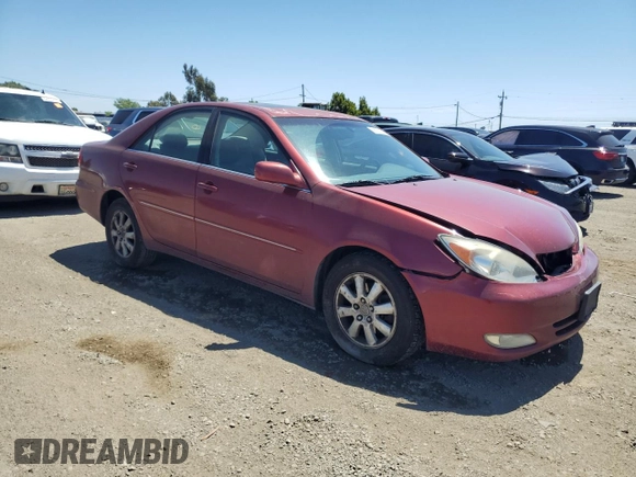 2003 Toyota Camry LE z VIN 4T1BF30K23U056007, wystawiony jako Copart lot #55187435 z przebiegiem 233 976 mil mil oraz Czysty tytuł • Clean title. Historia ofert i sprzedaży dostępna na DreamBid. Obrazek 4.