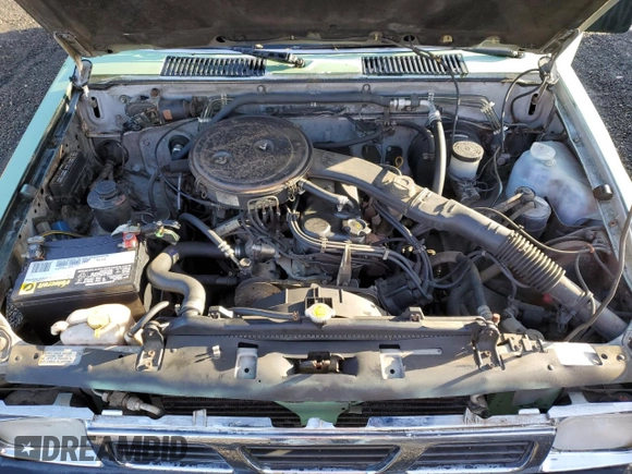 1989 Nissan Hardbody z VIN 1N6ND16S1KC396897, wystawiony jako Copart lot #85928624 z przebiegiem 148 866 mil mil oraz Szkody całkowita. Historia ofert i sprzedaży dostępna na DreamBid. Obrazek 11.