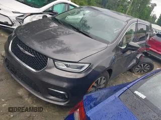 2023 Chrysler Pacifica Hybrid Touring L with VIN 2C4RC1L72PR540902, listed as a IAAI auction lot 42151047 with Not Provided miles and . Bid and sale history available at DreamBid. Image 21.