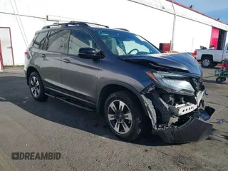 2019 Honda Passport Elite with VIN 5FNYF8H03KB007307, listed as a IAAI auction lot 41366590 with 99,375 mi miles. Bid and sale history available at carsss.com. Image 1.