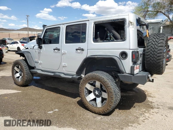 2012 Jeep Wrangler Unlimited Altitude with VIN 1C4HJWEG8CL163653, listed as a Copart auction lot 55279045 with 107,076 mi miles and Salvage title. Bid and sale history available at DreamBid. Image 2.