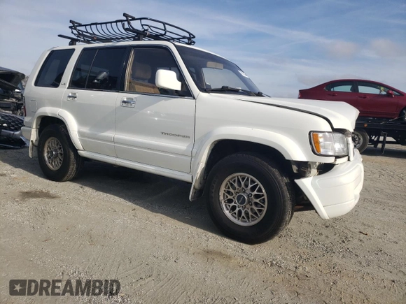 2000 Isuzu Trooper S with VIN JACDJ58X6Y7J06807, listed as a Copart auction lot 79179454 with 157,308 mi miles and Salvage title. Bid and sale history available at DreamBid. Image 4.