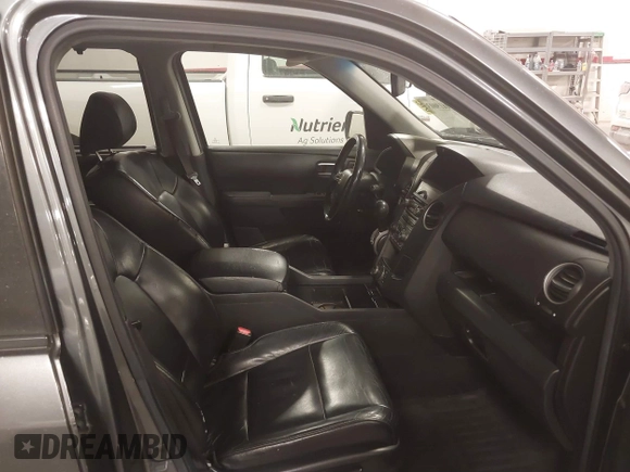 2012 Honda Pilot Touring with VIN 5FNYF4H98CB030879, listed as a IAAI auction lot 41619003 with 201,131 mi miles. Bid and sale history available at carsss.com. Image 5.