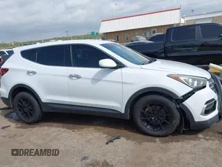 2017 Hyundai Santa Fe 2.4L z VIN 5XYZTDLB3HG439072, wystawiony jako IAAI lot #42061127 z przebiegiem 145 864 mil mil oraz . Historia ofert i sprzedaży dostępna na DreamBid. Obrazek 14.