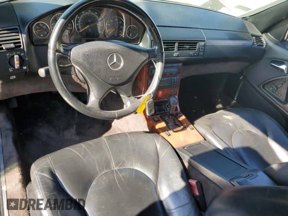 1999 Mercedes-Benz SL-Class with VIN WDBFA68F1XF184891, listed as a Copart auction lot 77082284 with 96,379 mi miles and Salvage Title. Bid and sale history available at carsss.com. Image 8.