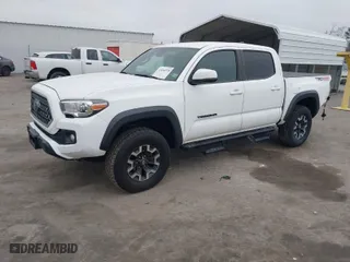 2019 Toyota Tacoma 4WD SR with VIN 5TFCZ5ANXKX204955, listed as a IAAI auction lot 41694378 with 108,410 mi miles. Bid and sale history available at carsss.com. Image 2.