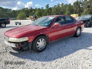 2000 Cadillac Seville Luxury SLS z VIN 1G6KS54Y3YU247875, wystawiony jako Copart lot #74712414 z przebiegiem 148 910 mil mil oraz Szkoda całkowita • Salvage title. Historia ofert i sprzedaży dostępna na DreamBid. Obrazek 1.