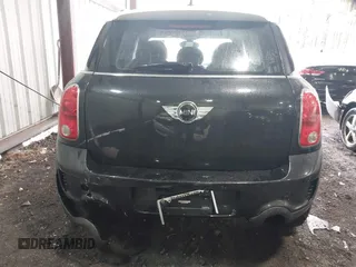 2014 MINI Countryman S with VIN WMWZC5C53EWP40677, listed as a IAAI auction lot 41473281 with 108,616 mi miles and . Bid and sale history available at DreamBid. Image 6.