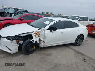 2017 Mazda 6 Grand Touring with VIN JM1GL1W57H1126716, listed as a IAAI auction lot 41619715 with 105,332 mi miles and . Bid and sale history available at DreamBid. Image 14.
