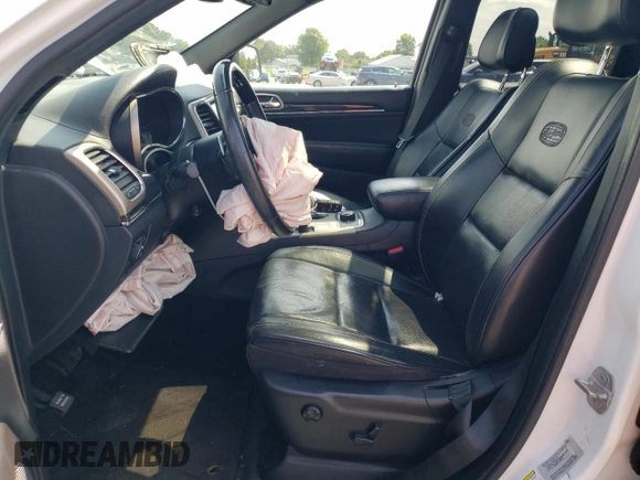 2015 Jeep Grand Cherokee Overland with VIN 1C4RJFCG6FC797653, listed as a Copart auction lot 65186695 with Not provided miles and Salvage title. Bid and sale history available at DreamBid. Image 7.