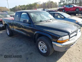 2003 Dodge Dakota SLT with VIN 1D7HL42X23S380999, listed as a IAAI auction lot 41826685 with 118,597 mi miles. Bid and sale history available at carsss.com. Image 1.