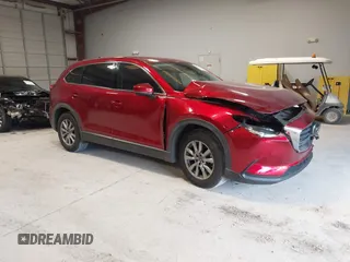 2019 Mazda CX-9 Touring z VIN JM3TCACY1K0331904, wystawiony jako IAAI lot #42146945 z przebiegiem 77 699 mil mil oraz . Historia ofert i sprzedaży dostępna na DreamBid. Obrazek 1.