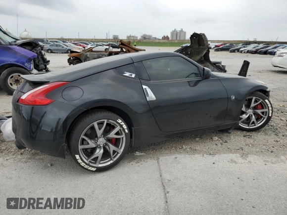 2014 Nissan 370Z Nismo z VIN JN1AZ4EH0EM634461, wystawiony jako Copart lot #53375685 z przebiegiem 171 858 mil mil oraz Szkoda całkowita • Salvage title. Historia ofert i sprzedaży dostępna na DreamBid. Obrazek 3.