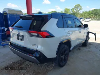 2021 Toyota RAV4 Hybrid XSE with VIN 2T3E6RFV9MW019837, listed as a IAAI auction lot 42002574 with 74,214 mi miles. Bid and sale history available at carsss.com. Image 4.