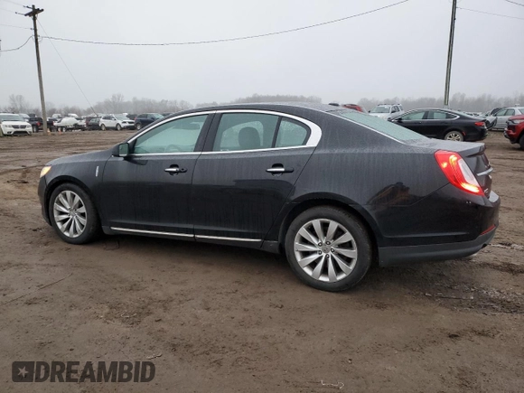 2015 Lincoln MKS with VIN 1LNHL9DK7FG606935, listed as a Copart auction lot 81991384 with 82,097 mi miles and Salvage Title. Bid and sale history available at carsss.com. Image 2.
