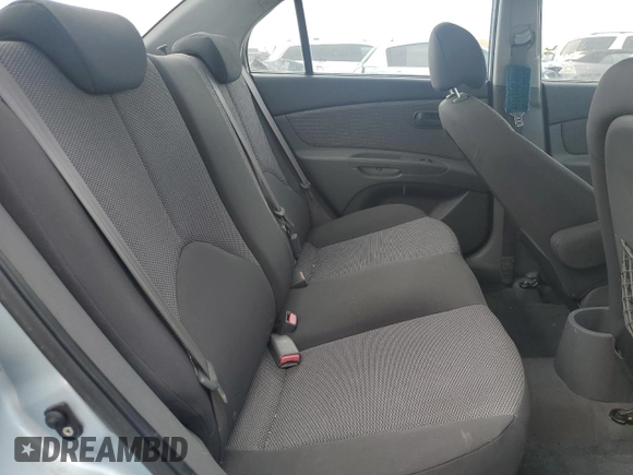 2009 Kia Rio LX with VIN KNADE223496469797, listed as a Copart auction lot 71005774 with 130,675 mi miles and Salvage Title. Bid and sale history available at DreamBid. Image 10.