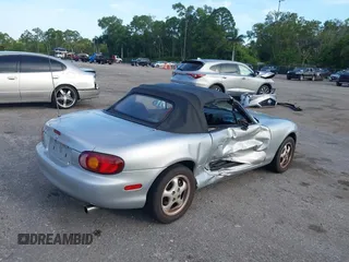 1999 Mazda MX-5 Miata with VIN JM1NB3534X0124237, listed as a IAAI auction lot 42536654 with 92,696 mi miles and . Bid and sale history available at DreamBid. Image 6.