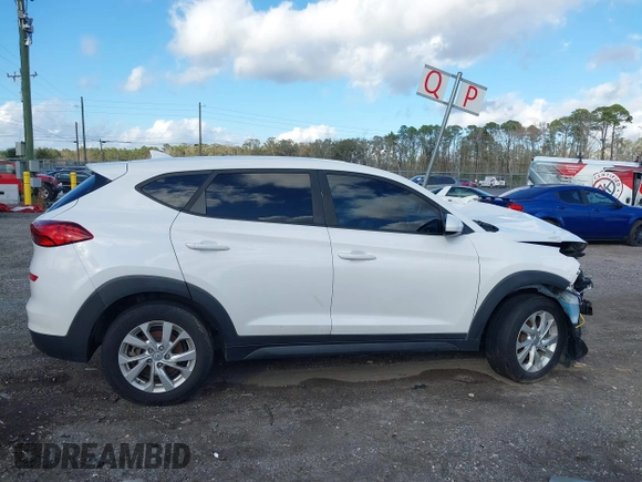 2019 Hyundai Tucson SE with VIN KM8J2CA48KU951829, listed as a IAAI auction lot 41261166 with 100,533 mi miles. Bid and sale history available at carsss.com. Image 13.