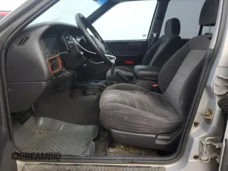 1997 Jeep Grand Cherokee Laredo with VIN 1J4GZ58Y6VC603370, listed as a Copart auction lot 82802794 with 0 mi miles and Salvage Title. Bid and sale history available at carsss.com. Image 7.