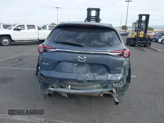 2021 Mazda CX-9 Grand Touring with VIN JM3TCADY1M0519288, listed as a IAAI auction lot 41186094 with 50,701 mi miles and . Bid and sale history available at DreamBid. Image 17.
