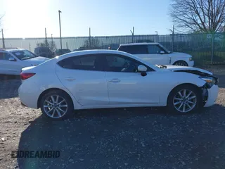 2017 Mazda 3 Touring with VIN 3MZBN1V75HM122123, listed as a IAAI auction lot 41853726 with 100,641 mi miles and . Bid and sale history available at DreamBid. Image 12.