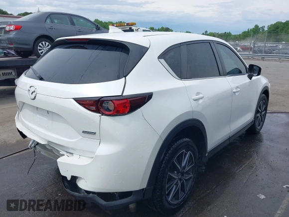 2018 Mazda CX-5 Touring with VIN JM3KFBCMXJ0366008, listed as a IAAI auction lot 42079989 with 153,868 mi miles and . Bid and sale history available at DreamBid. Image 4.