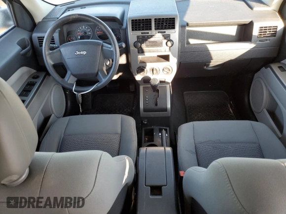 2007 Jeep Patriot Sport with VIN 1J8FF28WX7D355881, listed as a Copart auction lot 82766473 with 120,519 mi miles and Salvage Title. Bid and sale history available at DreamBid. Image 8.