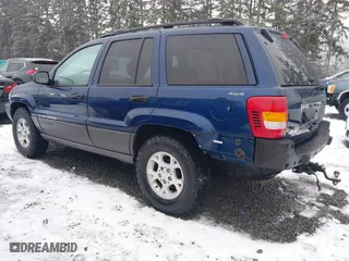 2001 Jeep Grand Cherokee Laredo with VIN 1J4GW48N21C730703, listed as a IAAI auction lot 41581667 with 111,054 mi miles. Bid and sale history available at carsss.com. Image 3.
