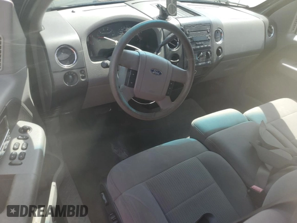 2007 Ford F-150 XL with VIN 1FTPX12V17FA62443, listed as a Copart auction lot 56409265 with 154,733 mi miles and Salvage title. Bid and sale history available at DreamBid. Image 8.