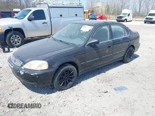 2000 Honda Civic LX with VIN 1HGEJ6670YL065386, listed as a IAAI auction lot 42199165 with 162,758 mi miles and . Bid and sale history available at carsss.com. Image 2.