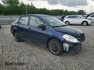 2009 Nissan Versa S with VIN 3N1BC11E19L433572, listed as a Copart auction lot 54084215 with 144,178 mi miles and Salvage title. Bid and sale history available at DreamBid. Image 4.