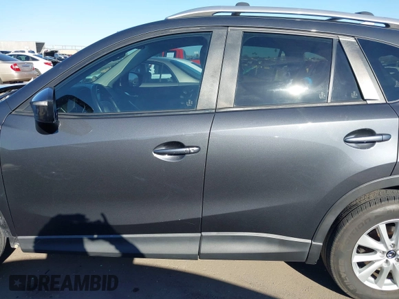 2016 Mazda CX-5 Touring with VIN JM3KE2CY4G0695947, listed as a IAAI auction lot 41824490 with 162,191 mi miles and . Bid and sale history available at carsss.com. Image 15.