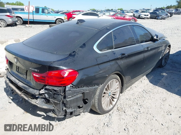 2015 BMW 4 Series 428i with VIN WBA4A5C51FG051393, listed as a IAAI auction lot 42041960 with 136,929 mi miles and . Bid and sale history available at carsss.com. Image 4.