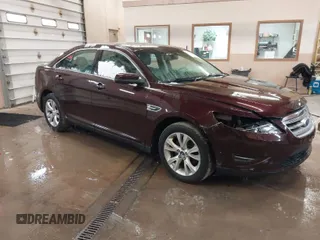 2011 Ford Taurus SEL z VIN 1FAHP2HW5BG141570, wystawiony jako IAAI lot #41867097 z przebiegiem 172 984 mil mil oraz . Historia ofert i sprzedaży dostępna na DreamBid. Obrazek 1.