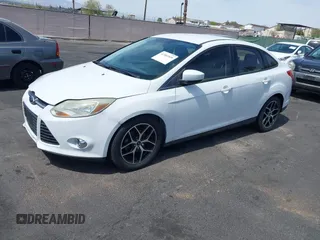 2012 Ford Focus SE with VIN 1FAHP3F24CL462319, listed as a IAAI auction lot 41981509 with 124,831 mi miles. Bid and sale history available at carsss.com. Image 2.