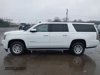 2015 GMC Yukon XL SLT with VIN 1GKS1HKC7FR223513, listed as a IAAI auction lot 40822575 with 128,239 mi miles. Bid and sale history available at carsss.com. Image 14.